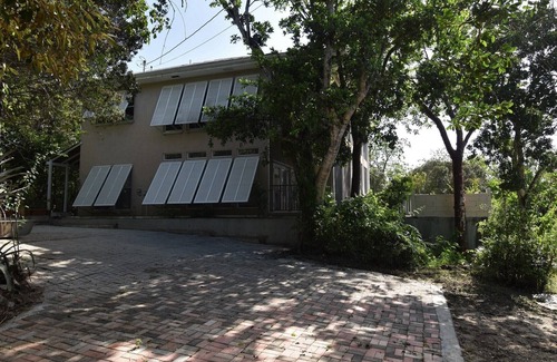 North Side House | Quiet, private nature retreat with pool and ocean views.