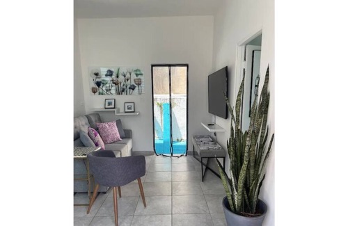 Sagrado Corazon Apartment | Red Door Lovely 1 Bedroom unit with small patio