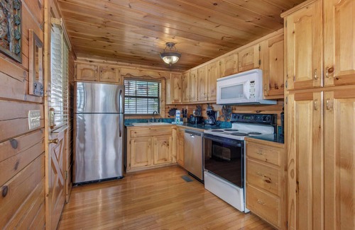 Gatlinburg - Pigeon Forge Cabin | Rejuvenation is a beautiful two-bedroom cabin in Starr Crest Resort.