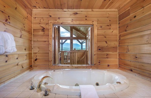 Gatlinburg - Pigeon Forge Cabin | Rejuvenation is a beautiful two-bedroom cabin in Starr Crest Resort.