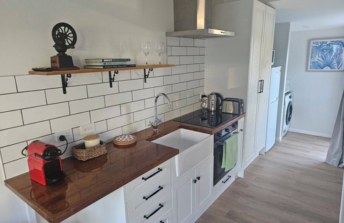 Long Bay Apartment | Relax and enjoy the North Shore in this cozy and stylish unit.