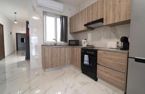 Tarxien Apartment | Relaxed 2BR Home with Backyard & Balconies,Tarxien