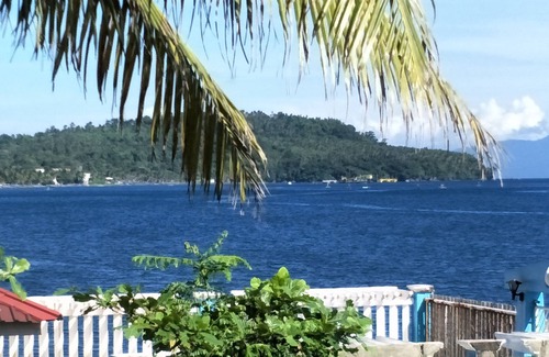 Calapan Condo | Relaxing beach side condo with mountain and island views.