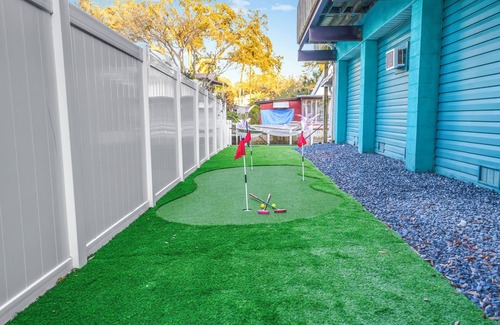 Weeki Wachee Gardens House | River home with huge arcade, hot tub kayaks, mini golf and floating pad, 80in TV