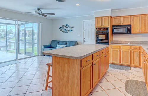 Venetian Way House | Riverfront home with private heated pool, dock, AC & W/D - dog-friendly