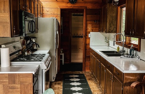 Bragg Creek Cabin | Riverside Bragg Creek Cabin in the Heart of Town