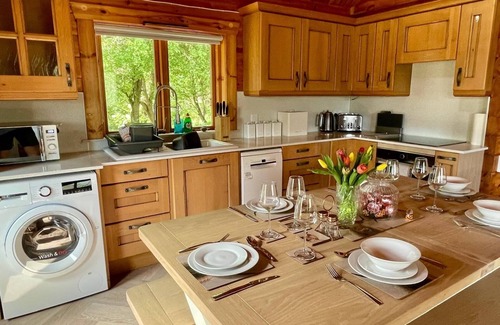 Aberchirder Cabin | Riverside Lodge—3-Bed Retreat in AberdeenshirenCozy, scenic, and peaceful.