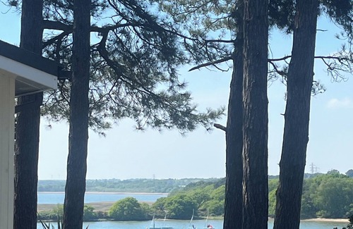 Hamworthy Ski Chalet | Robin’s Lodge with a sea view