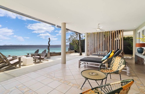 Belnem House | Romantic oceanfront studio in Bonaire with private porch and sea views. Perfect for couples seeking peace, privacy, and tropical charm.