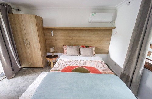 Aburi Bed & Breakfast | Rustic and unique private room with large wraparound balcony up in the Trees!