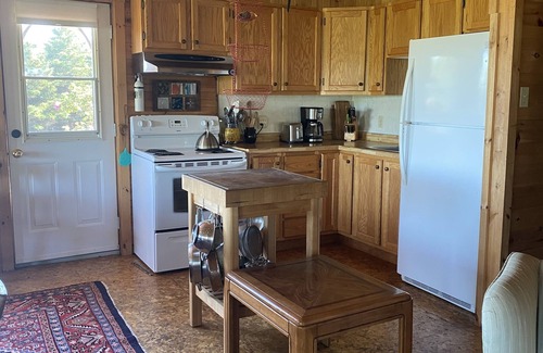 Green Bay Cottage | Rustic Comfy Cottage in the heart of NS Ocean Playground. Walk to Beach.