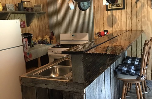 Hardy Cabin | Rustic Log Cabin on private land, with ample gravel roads for horses and ATV’s.