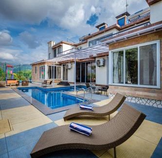 Karjat Villa | SaffronStays Casa De Familia, Karjat - pool villa with ample open space for outdoor games
