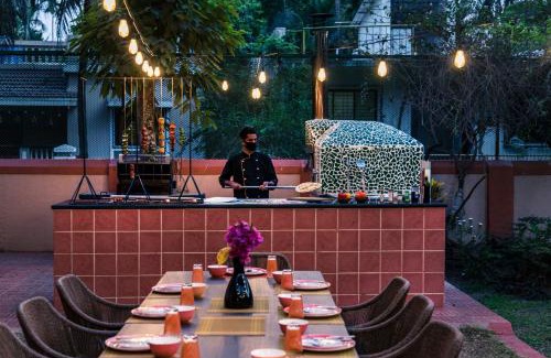 Alibaug Villa | Saffronstays Casa Del Palms, Alibaug - luxury pool villa with chic interiors, alfresco dining and island bar