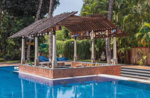 Alibaug Villa | Saffronstays Casa Del Palms, Alibaug - luxury pool villa with chic interiors, alfresco dining and island bar