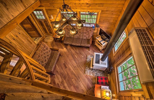 Titusville Cabin | Scenic Log Cabin with Fire Pit & Stocked Creek!