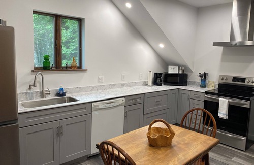 Harpswell Apartment | Second floor space with modern conveniences & artistic charm.