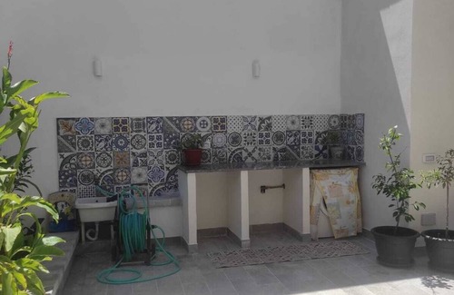 Isola delle Femmine Apartment | Self-contained apartment with outdoor patio within walking distance of the sea and downtown.