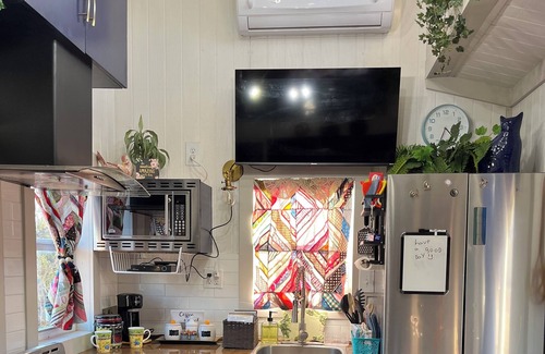 Sweetwater House | “SERENDIPITY” a boho inspired tiny home on wheels in country setting