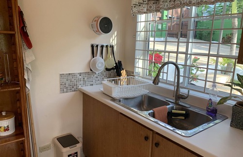 Constant Spring Apartment | "Serenity". Peaceful work-friendly, self-contained suite with mountain view.