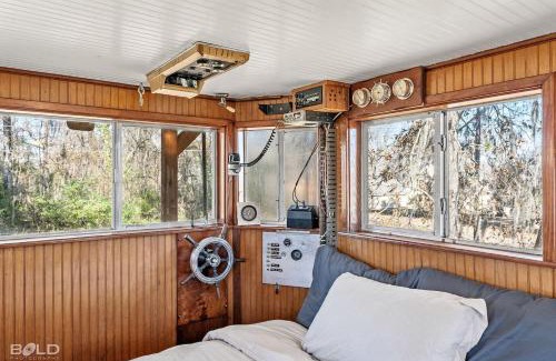 Uncertain House | Shipwreck With Upper Deck & Kayaks & Canoes