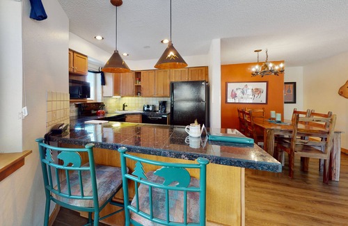 Four O'Clock Condo | Ski-in/out ground-floor condo with hot tubs, fireplace, gym & views