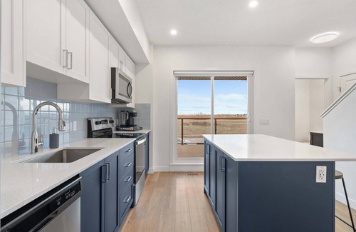 Calgary House | Skyline Retreat | Spacious 4BR Home with Balcony!