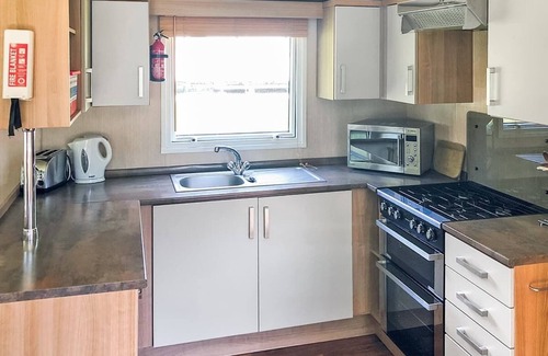 Saint Ann's Chapel House | Spacious 12ft-wide family caravan with one double and one twin.