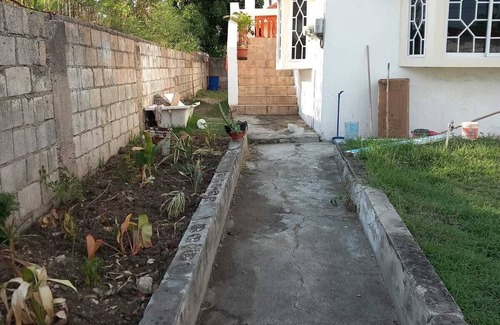 Spanish Town House | Spacious 5-bedroom estate in serene Spanish Town with WiFi, AC
