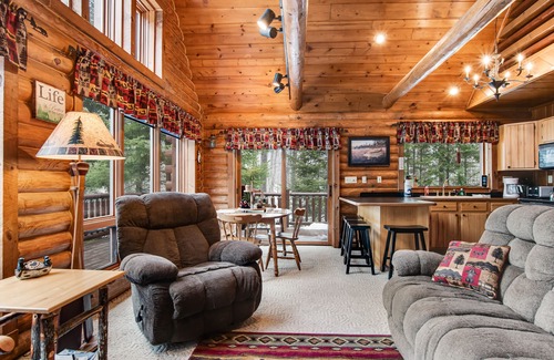 Presque Isle Cabin | Spacious and beautiful lakefront log home on 7 acres with private dock