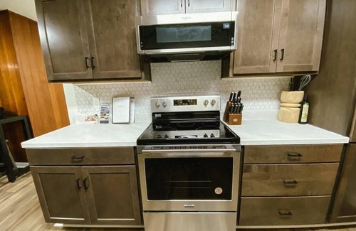 Parsons House | Spacious home in downtown Parsons! Conference room, HS internet, & private yard
