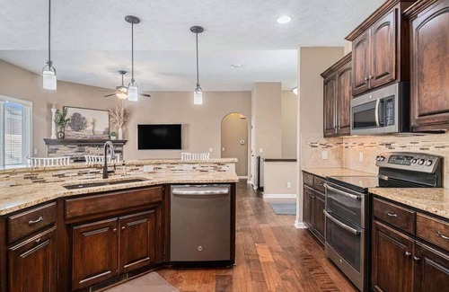 Millard House | Spacious Retreat in West Omaha 2 King 3 Queen Beds