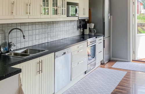 Harryda Municipality House | Spend an unforgettable vacation near the lake in this inviting vacation home.