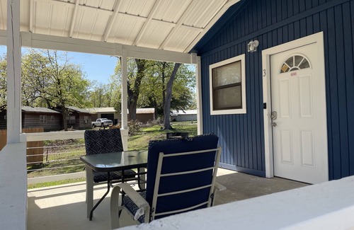 Porum Cabin | Studio cabin #2 with lake view, boat dock access, outdoor seating, and firepit.
