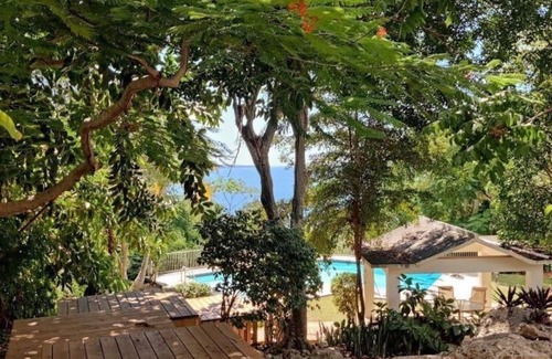 Borinquen Villa | Stunning 1950's grand house nestled in lush greenery overlooking the bay