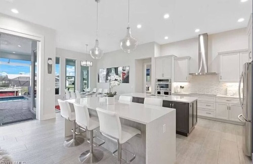Eight Lakes House | Stunning New Waterfront Luxury Villa with oversized Heated pool and Hot tub!