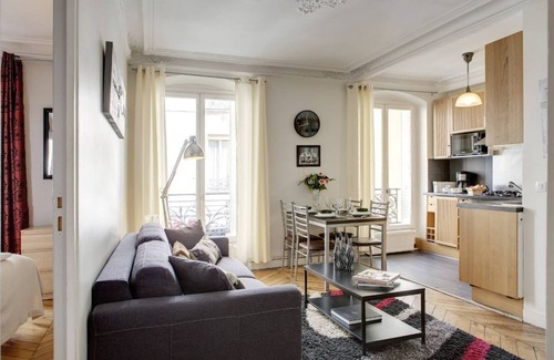 Strasbourg -Saint-Denis Apartment | STYLISH CONTEMPORARY APT: ELEGANT GRAY,RED & BLACK ACCENTS IN BOURGEOIS BUILDING