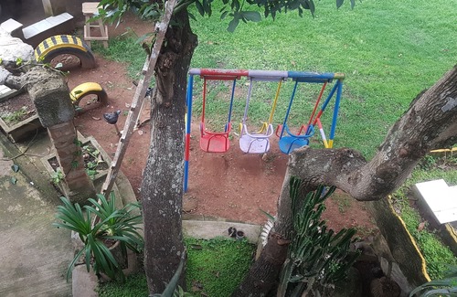 Kampala Apartment | Stylish three bedroom African-themed holiday home! Private baths and kitchen.