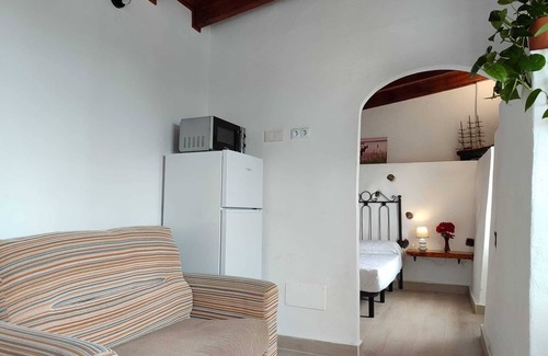 Buen Paso Apartment | Sunny balcony, large garden and private parking, 10 minutes from the beach.
