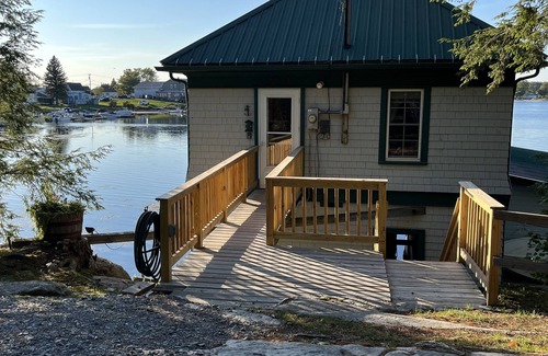 Fishers Landing Cottage | Sunny cottage built over the water on the St. Lawrence River