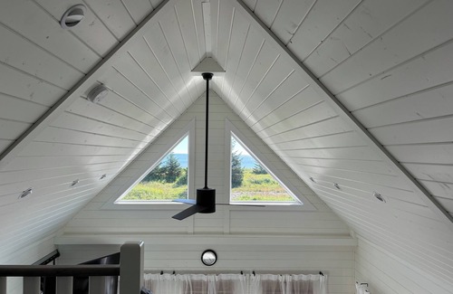 Moresby Island House | Sunrise Loft cozy private beach front house storm watching sleeps 4