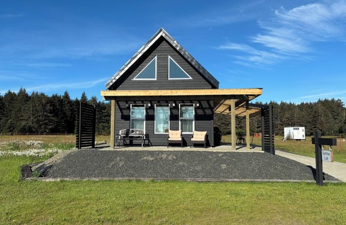 Moresby Island House | Sunrise Loft cozy private beach front house storm watching sleeps 4