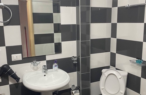 Sarande Apartment | The apartment has a beautiful view of the city and the sea with a balcony.