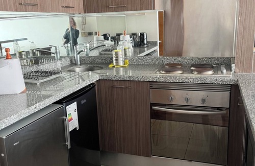 Apoquindo Apartment | The department is two blocks away from Manquehue metro station