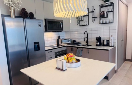 San Jose Apartment | The Dorian-Luxurious Chic 1-Bdr Apt- AC,Gym,Pool,WiFi, Minutes from SJO Airport