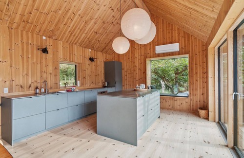 Frederiksvaerk House | This modern and stylish wooden house welcomes you with round pool in the garden.