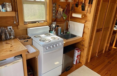 Ashe County Cabin | Tiny, charming mountaintop cottage with large firepit, deck and amazing views