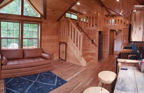 Negreet Cabin | Tiny Toledo - Lakefront Cabin with Boathouse, Fishing Pier, and DRAMATIC Sunsets