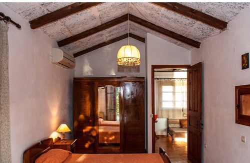 Paleros Villa | Traditional, rustic, seafront villa, just steps away from the beach.