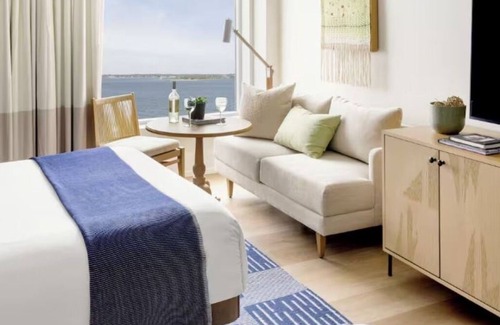 Goat Island Hotel | Tranquil Newport Getaway: Four Serene Waterview Rooms | Pets are Allowed